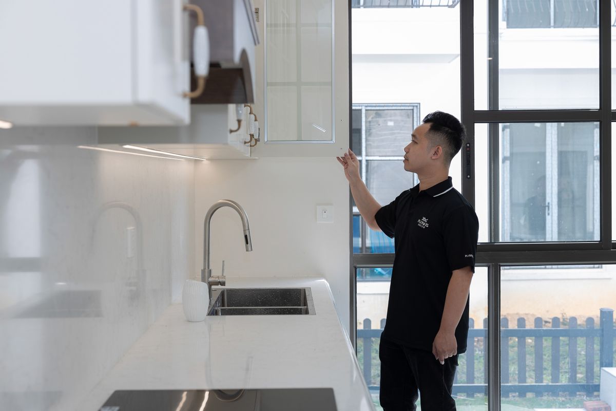 A homebuyer doing a unit inspection during property turnover in the Philippines, reviewing finishes and fixtures