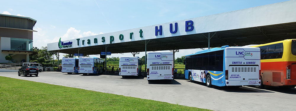 LNC Link transport facility exterior inside Lancaster New City, Imus Cavite — the community's own internal bus system connecting residents across the masterplan