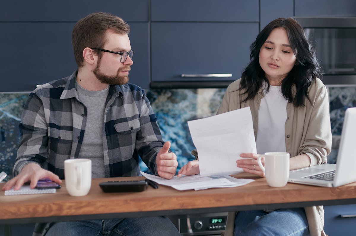 Buyer reviewing condo Contract to Sell document before signing