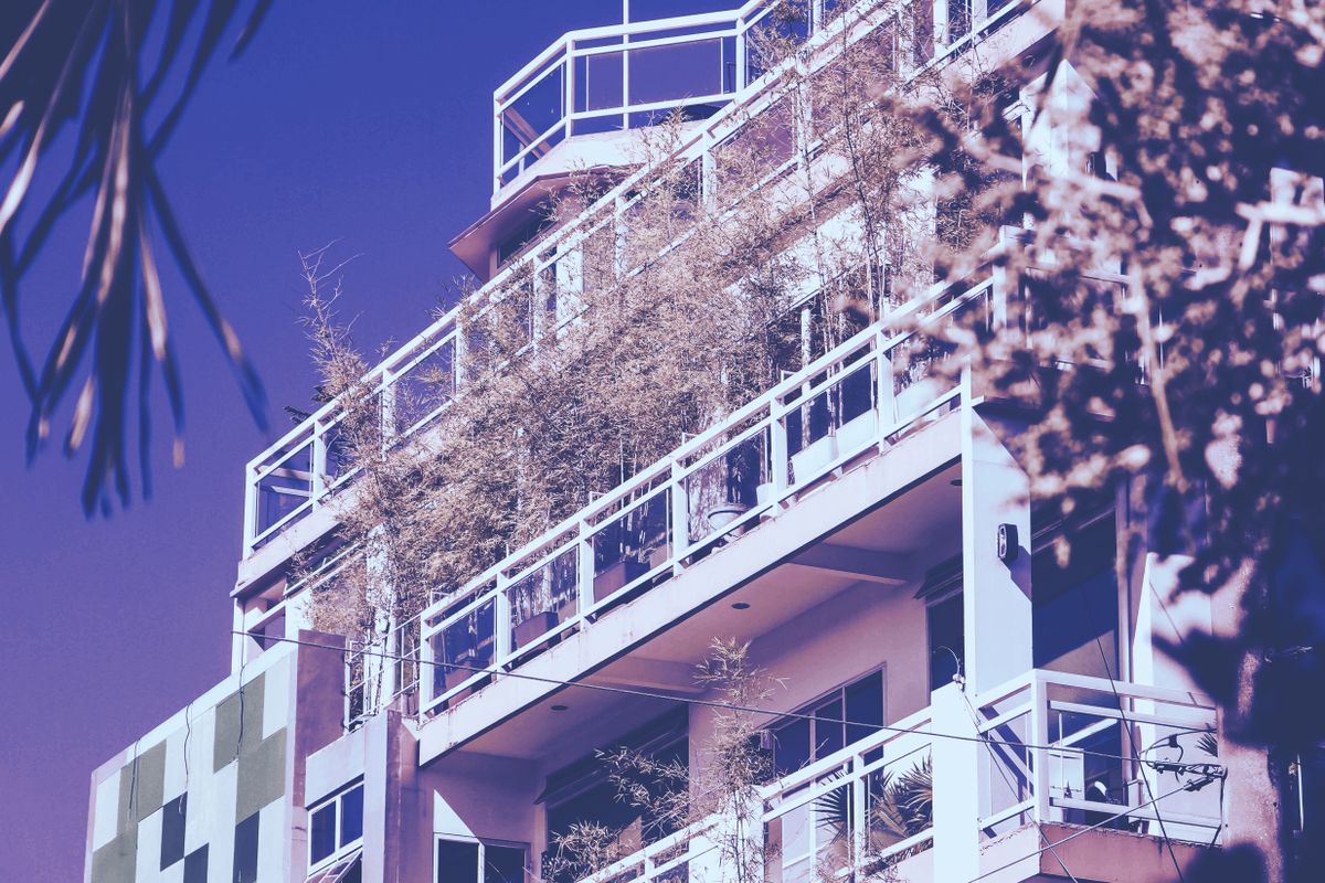 Studio condo balcony view overlooking a landscaped garden community in Cavite